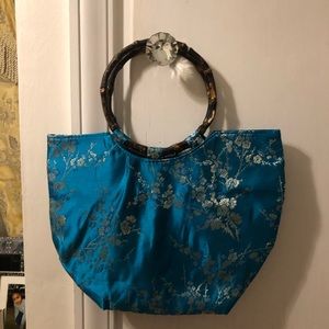 Bamboo handle blue print purse